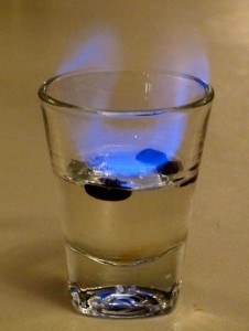 flaming sambuca with espresso beans